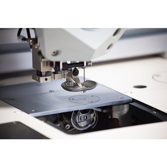 programmable sewing machine for automotive and marine interiors and parts